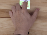Acustico: Surface Tap Detection and Localization using Wrist-based Acoustic TDOA Sensing